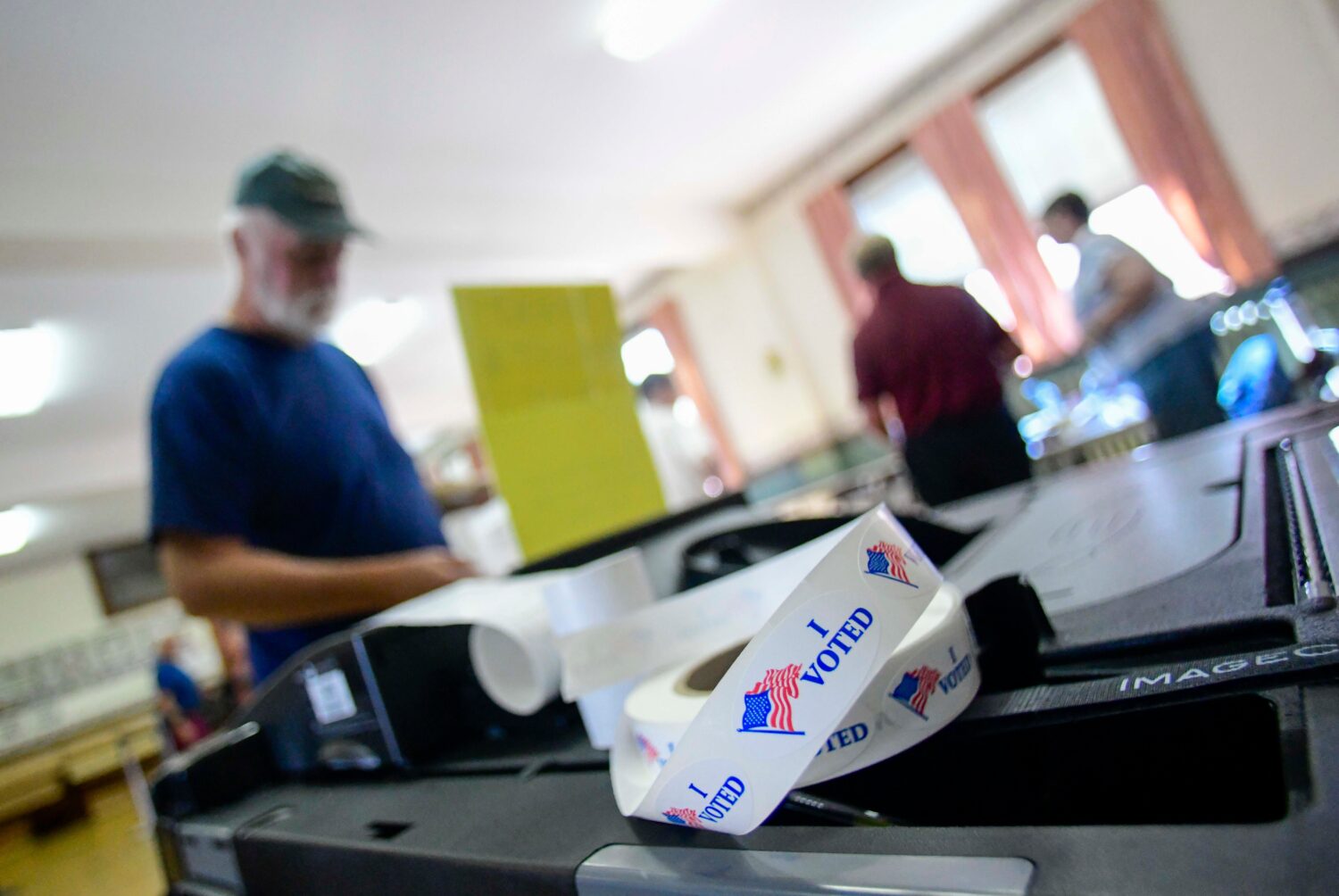 Sean Reid of Rockingham, Vt., casts his ballot at the polling station in Rockingham during Vermont'...