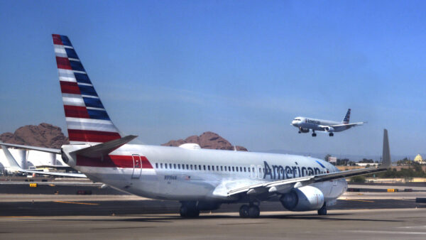 FILE — An American Airlines jet takes off as another taxis at Phoenix Sky Harbor International Airport on April 23, 2018. (Photo by Robert Alexander/Getty Images)
