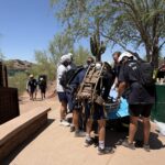 Rescuers deployed a "big wheel" operation to safely wheel the boy down the steep trail to the trailhead. (Phoenix Fire Department)