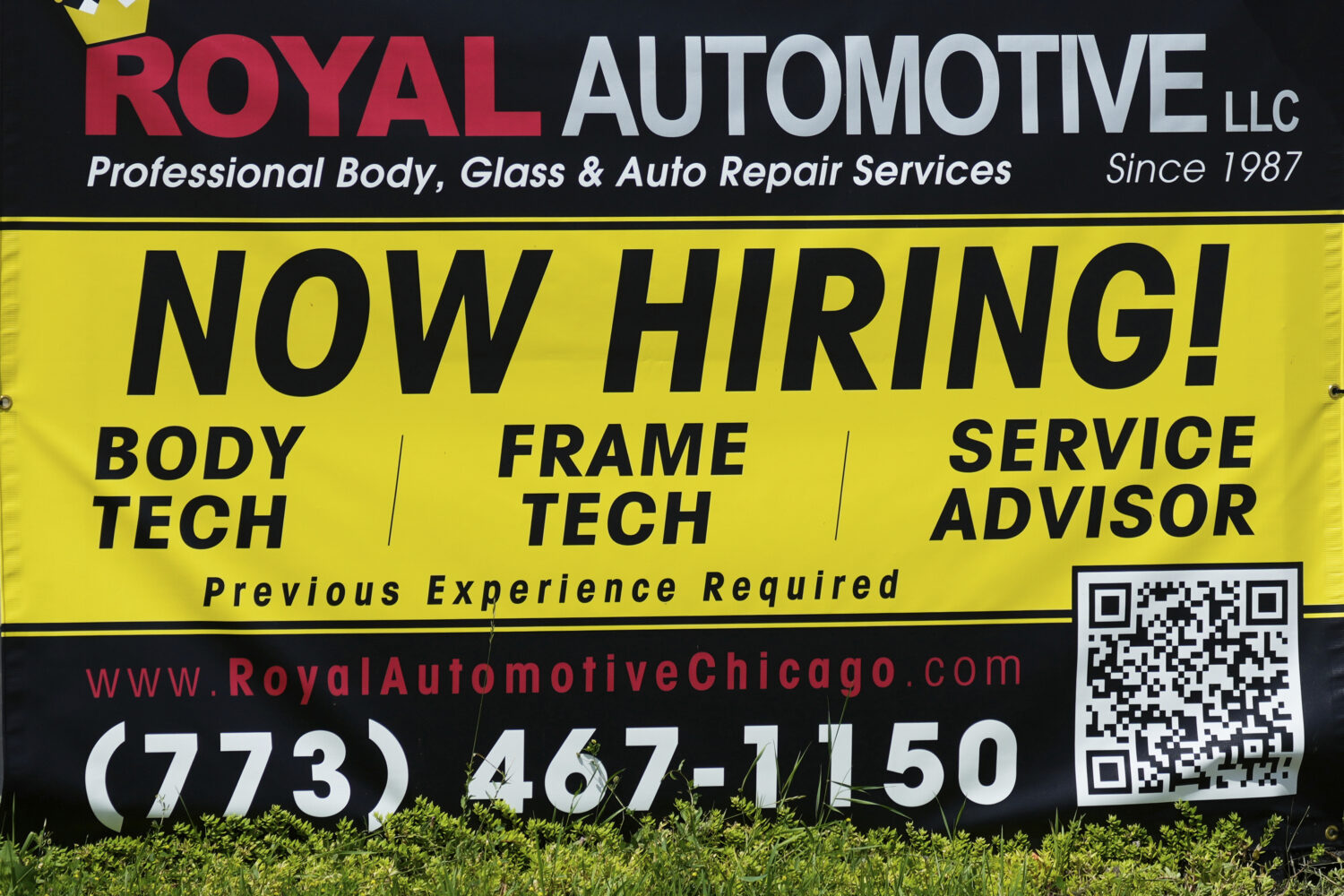 FILE - A now hiring sign is seen in front of an auto body shop in Chicago, June 25, 2026. (AP Photo...