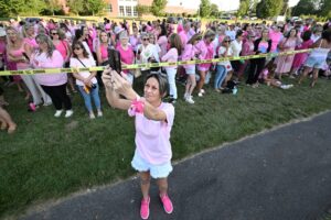 Women in pink rally in support of Lindsay Clancy who is on trial for killing 3 children