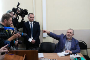 A Putin critic leaves Russia after he is barred him from running for parliament