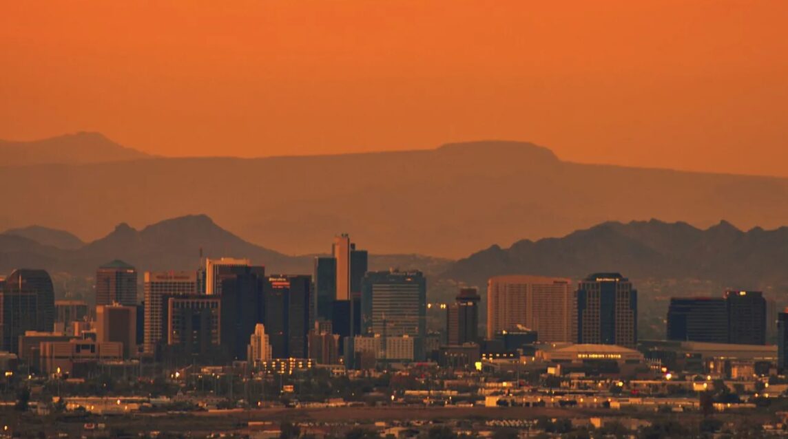 The sun blazes through clouds over the desert Southwest as Phoenix breaks a 15-year-old heat record...