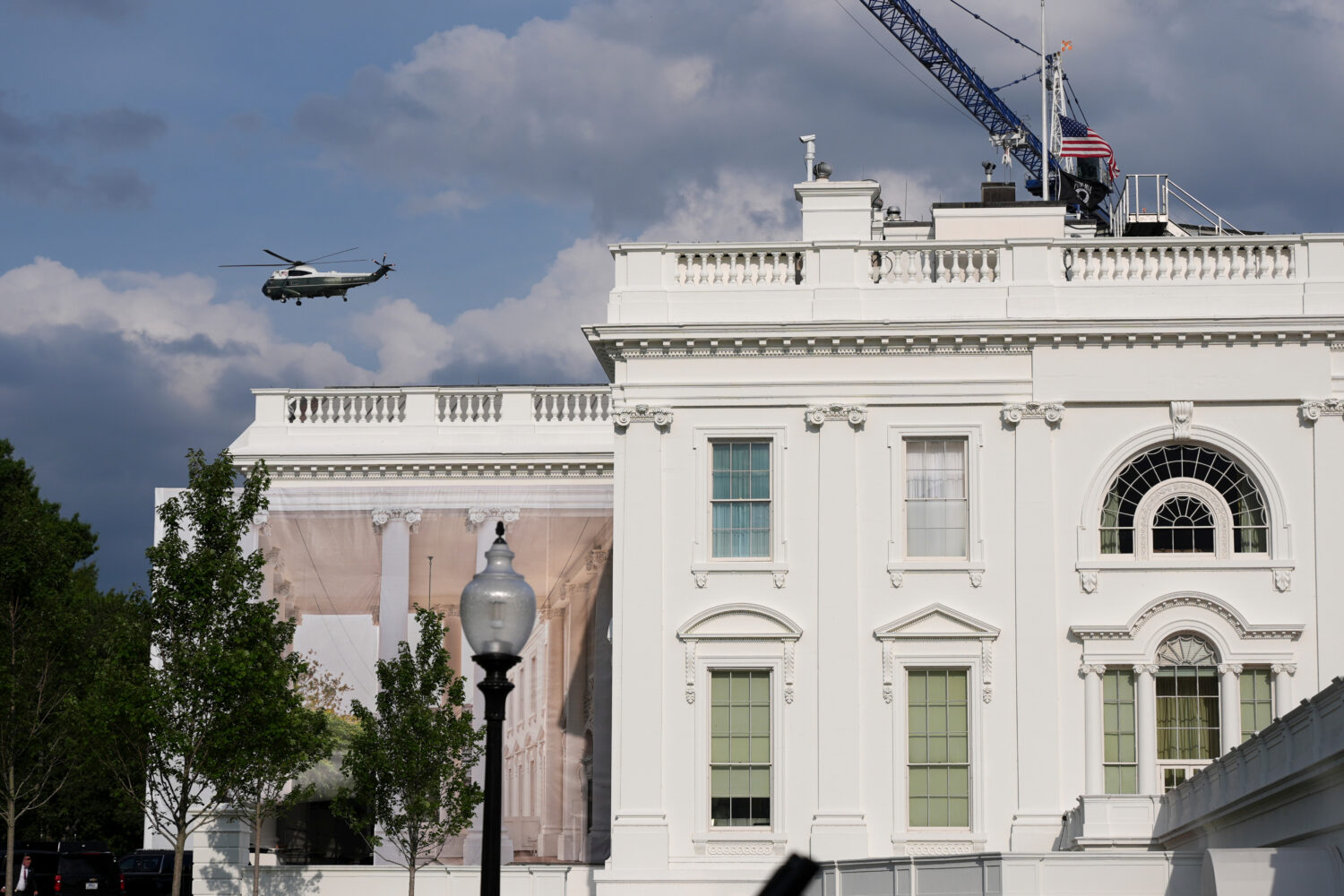 A helicopter from Marine Helicopter Squadron One, or HMX-1, flies past the White House after Presid...