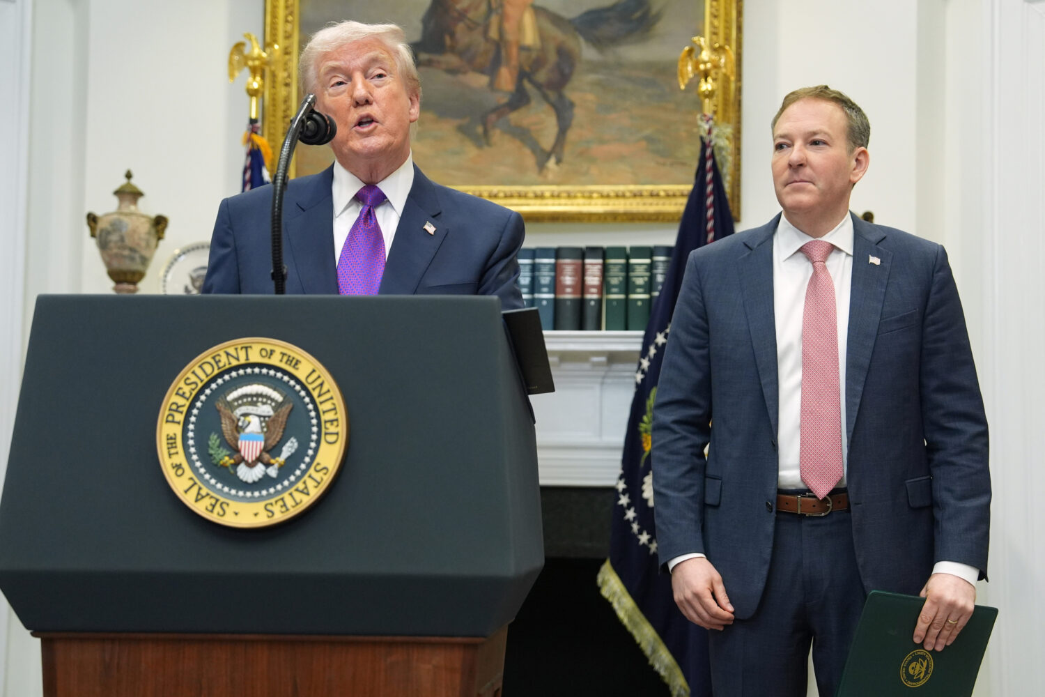 FILE - President Donald Trump, left, speaks during an event with Environmental Protection Agency di...