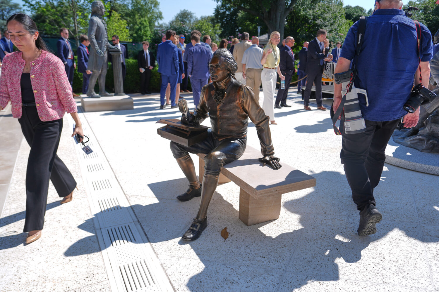 FILE - A bronze depiction of Thomas Jefferson seated and signing the Declaration of Independence is...