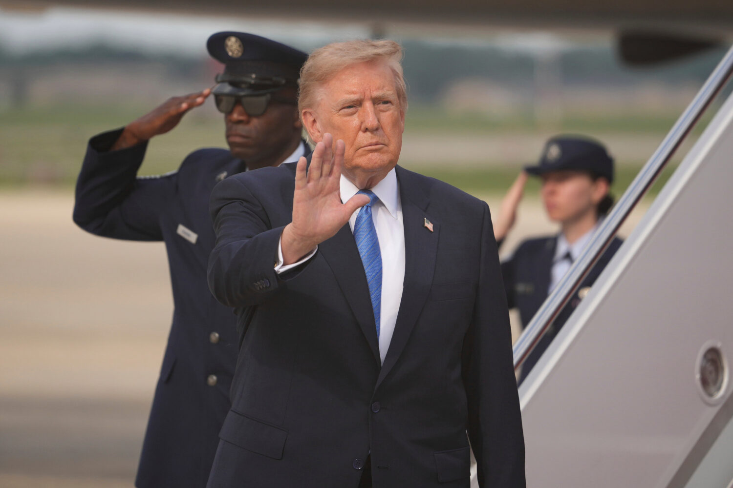 President Donald Trump waves after arriving off Air Force One, Friday, Aug. 28, 2026, at Joint Base...