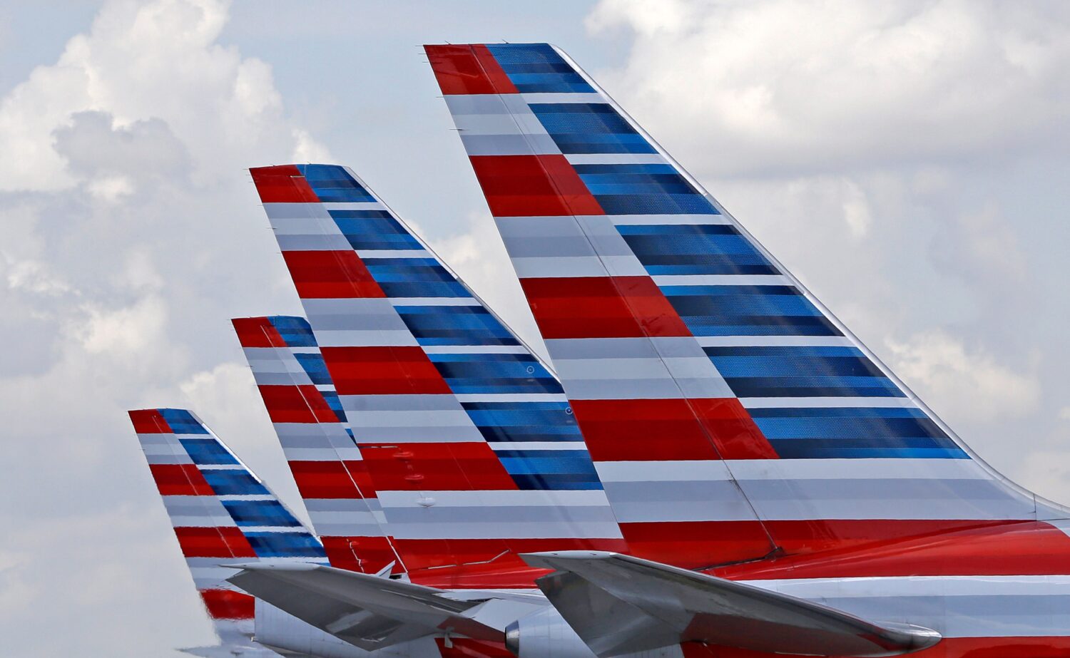 FILE - American Airlines passenger planes are parked at Miami International Airport, in Miami on Ju...