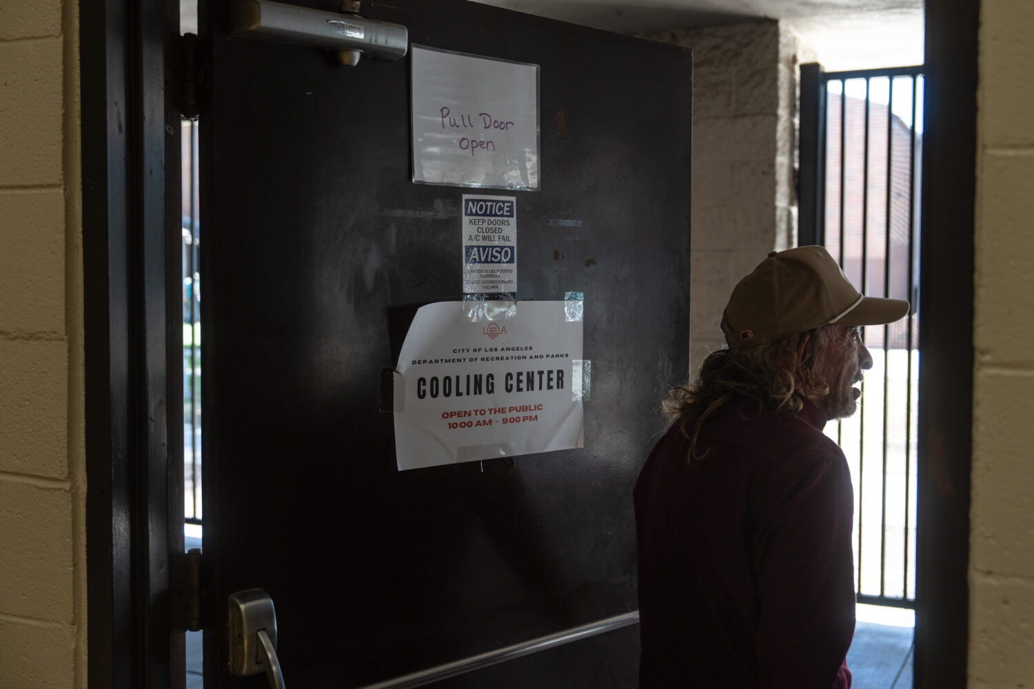 Daniel Aragonez leaves a cooling center in Los Angeles, Friday, July 31, 2026. (AP Photo/Jae C. Hon...