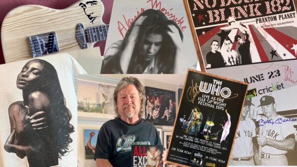 Danny Zelisko surrounded by memorabilia promoting Arizona music history.