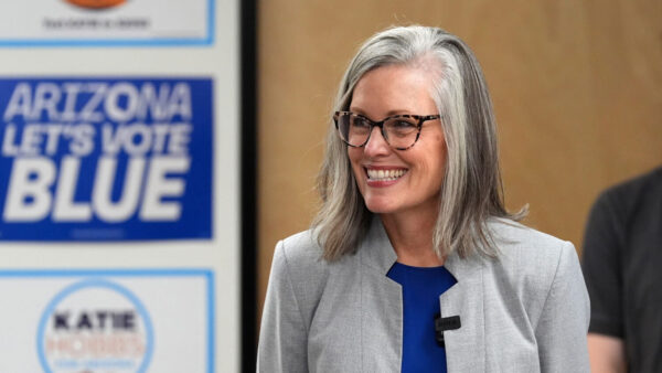 Arizona Democratic Gov. Katie Hobbs smiles as she meets with campaign volunteers as voters cast their ballots on primary election day, Tuesday, July 21, 2026, in Phoenix. (AP Photo/Ross D. Franklin)