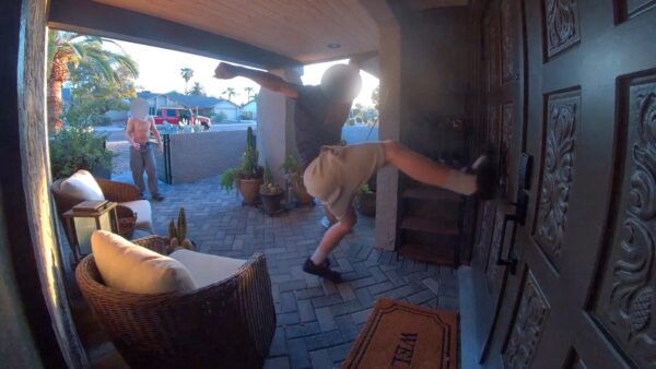 Doorbell camera footage shows a person kicking the front door of a Phoenix home (Photo via Phoenix Police Department)