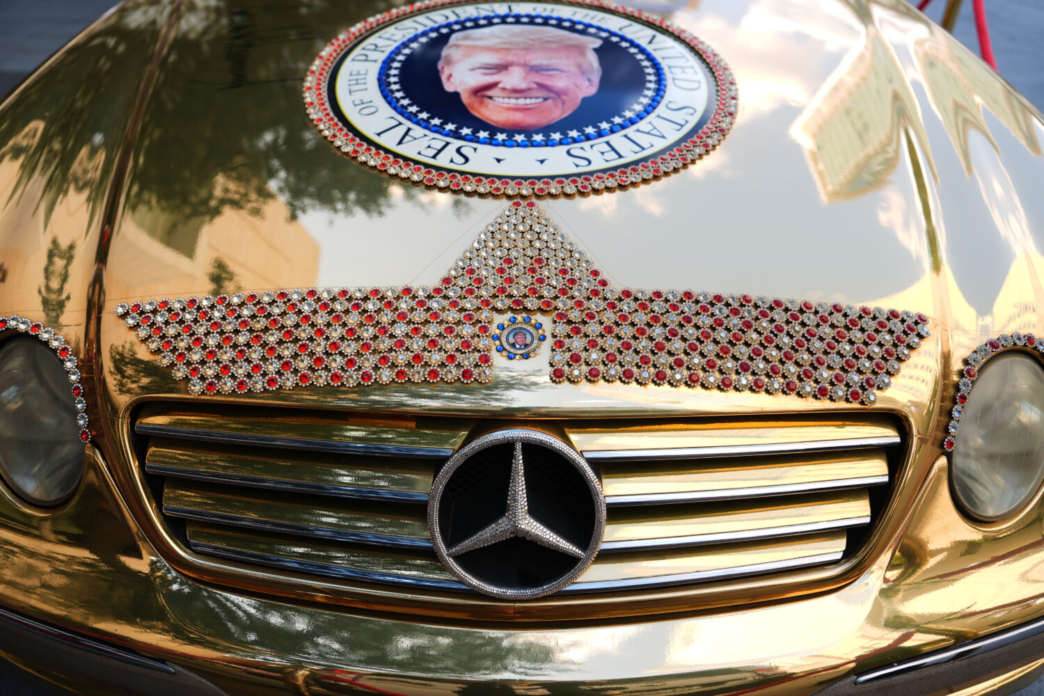 A Mercedes decorated with images of President Donald Trump is seen outside before the Republican co...