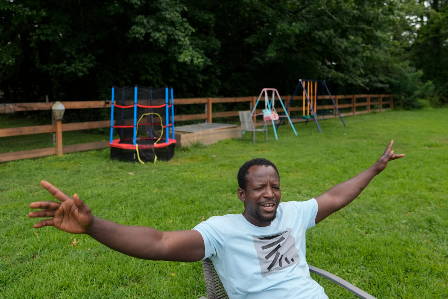 Khalidou Sy, a Mauritanian immigrant, talks in the backyard of his family's home in Lockland, Ohio,...