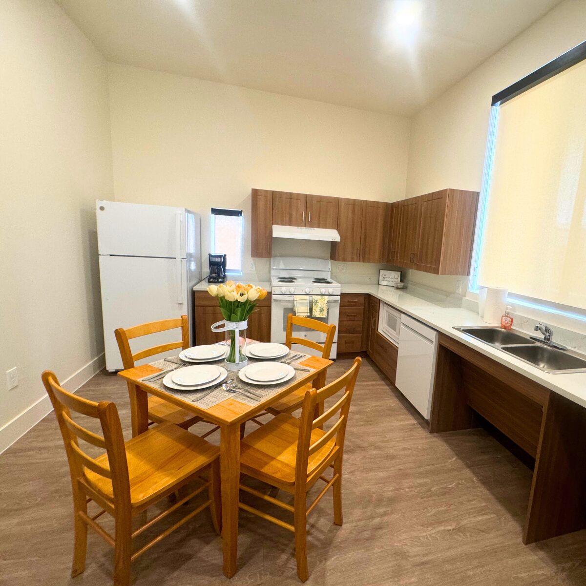 A kitchen inside one of Avondale's new Family Bridge Homes. The six two-bedroom homes provide tempo...