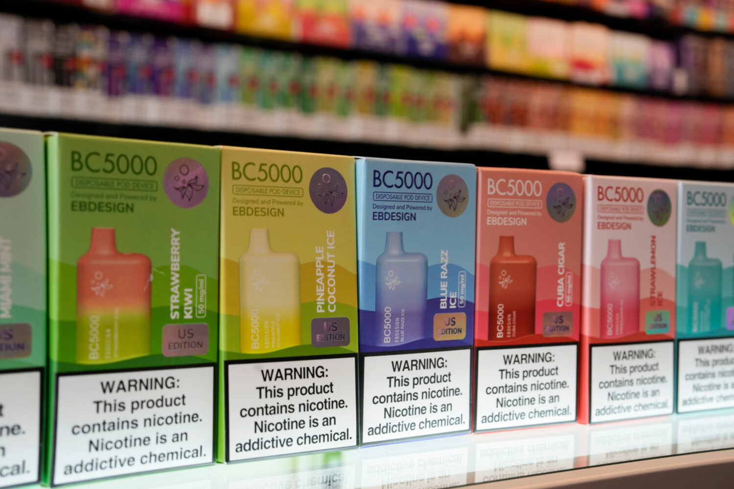 FILE - Varieties of disposable flavored electronic cigarette devices manufactured by EB Design, for...