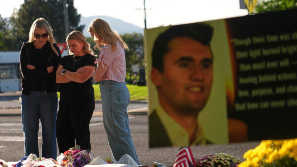 FILE - Women pray at a memorial outside Utah Valley University after Turning Point USA CEO and co-founder Charlie Kirk was shot and killed, Sept. 13, 2025, in Orem, Utah. (AP Photo/Lindsey Wasson, File)Credit: AP Photo/Lindsey Wasson