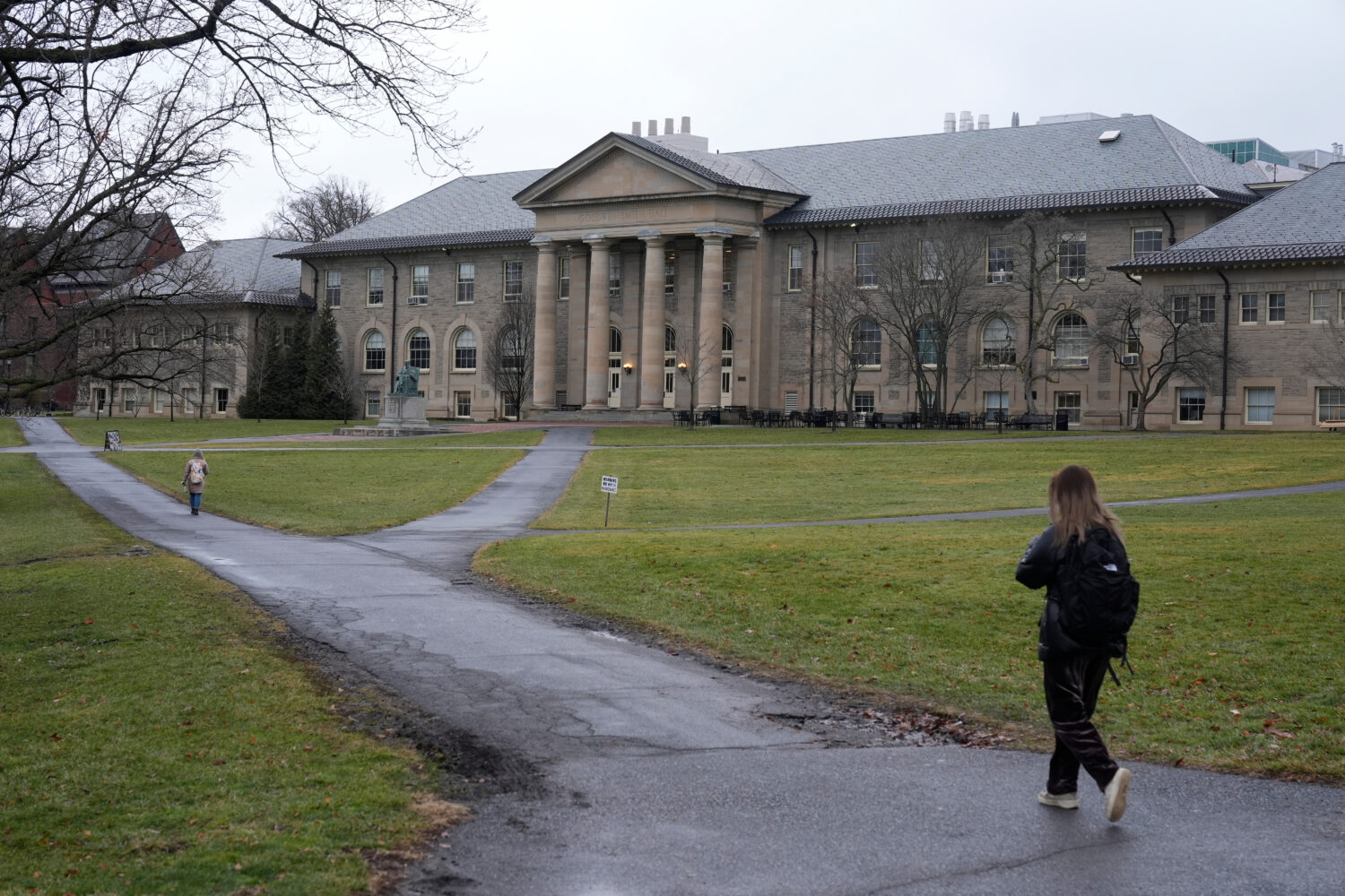 FILE - People walk on the campus of Cornell University in Ithaca, N.Y., Friday, Feb. 2, 2024. (AP P...
