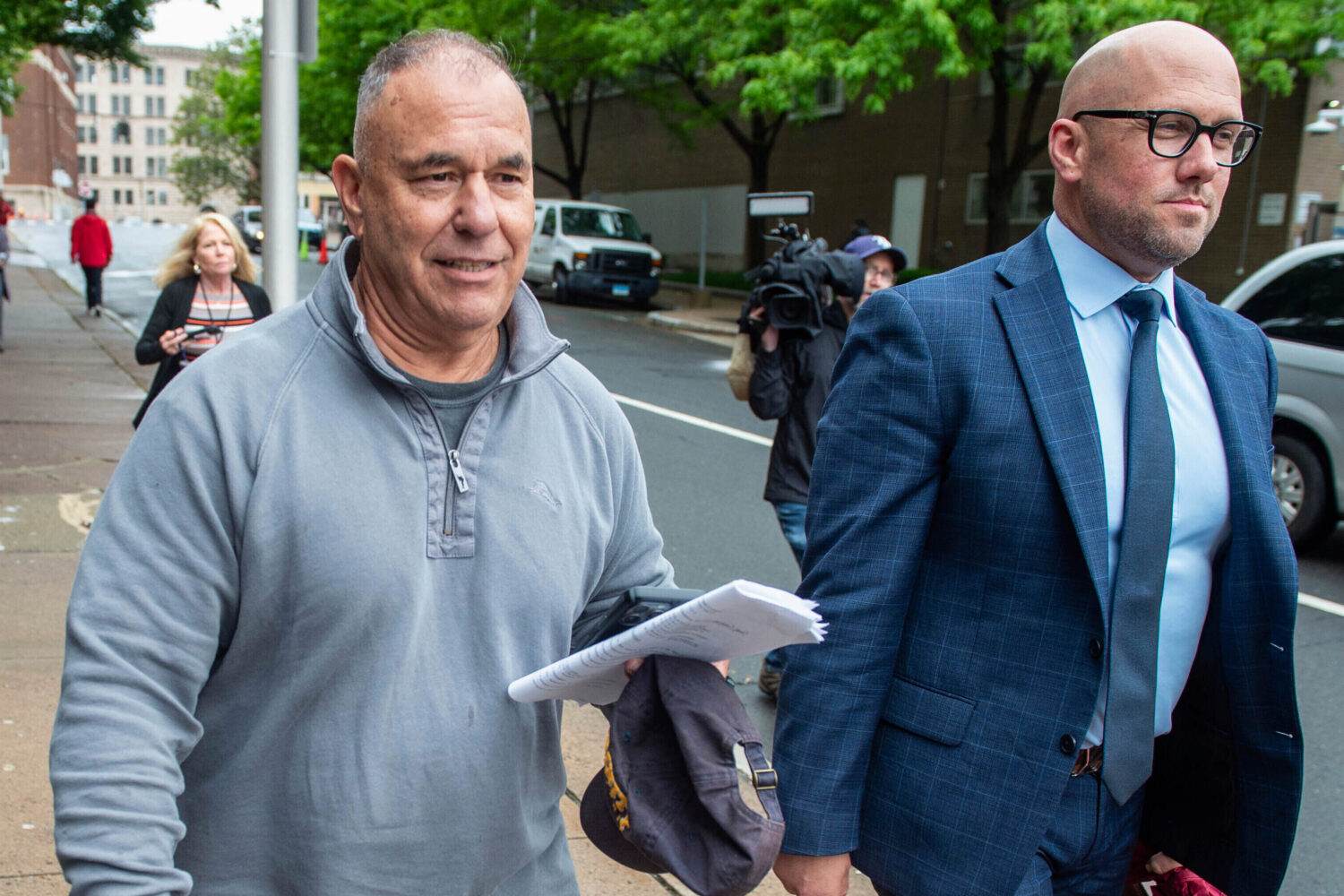 FILE - Former Connecticut deputy budget director Konstantinos "Kosta" Diamantis, left, accompanied ...