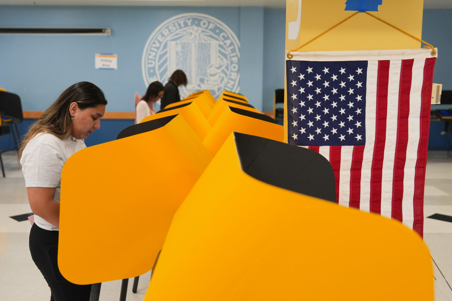 FILE - Voters cast their ballots at a voting center on the UCLA campus, June 2, 2026, in Los Angele...