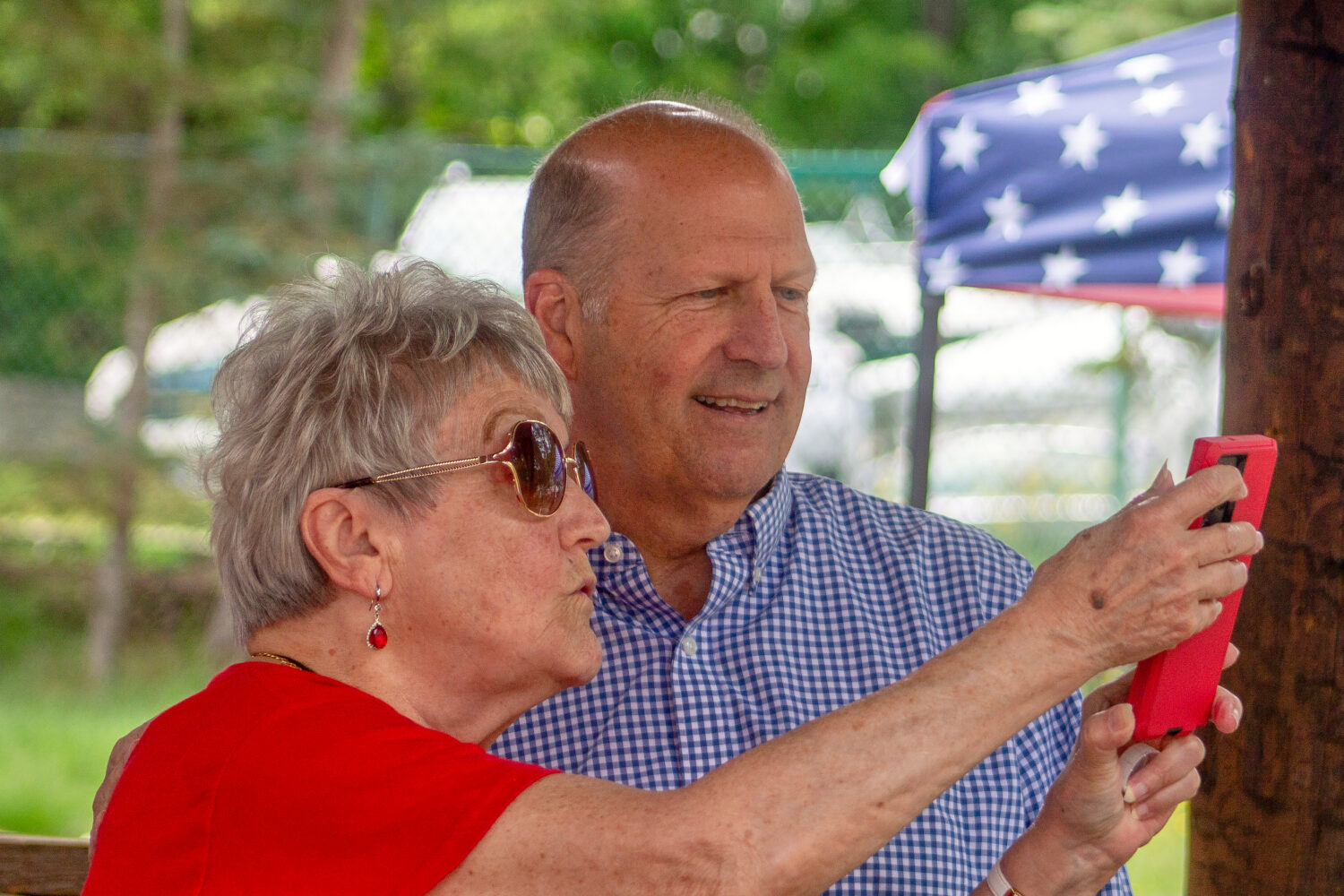 Former Sen. John E. Sununu, who is seeking the GOP nomination for his old seat, takes a selfie with...