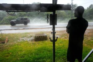 Edouard, now a tropical depression, drenches Texas with flash flooding and downed trees