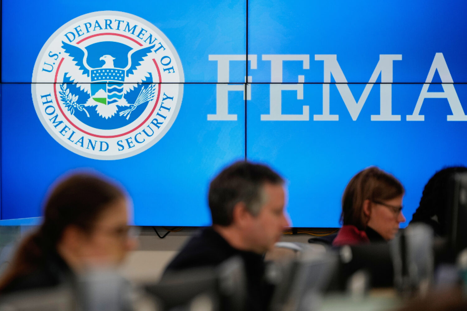 FILE - People work at the Federal Emergency Management Agency headquarters in Washington, Jan. 24, ...