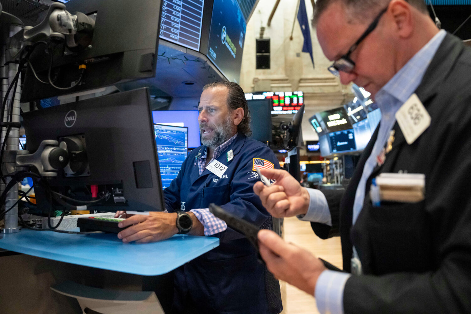 Specialist Michael Pistillo works on the floor of the New York Stock Exchange, Thursday, Aug. 27, 2...