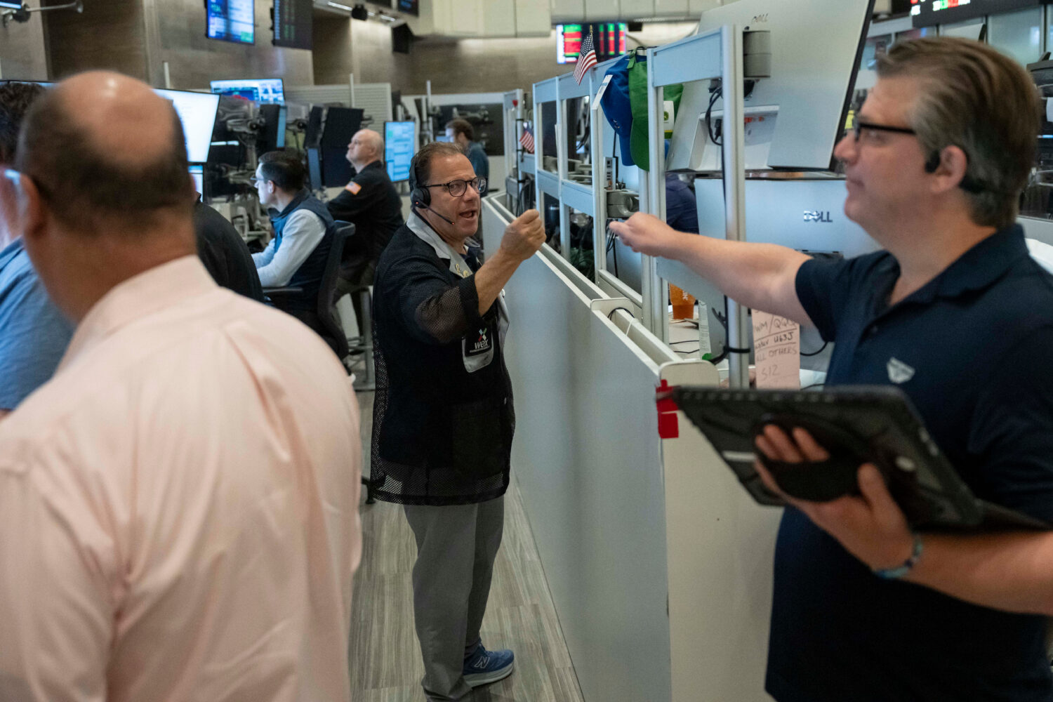 Options trader Anthony Spina works on the floor of the New York Stock Exchange, Thursday, Aug. 27, ...