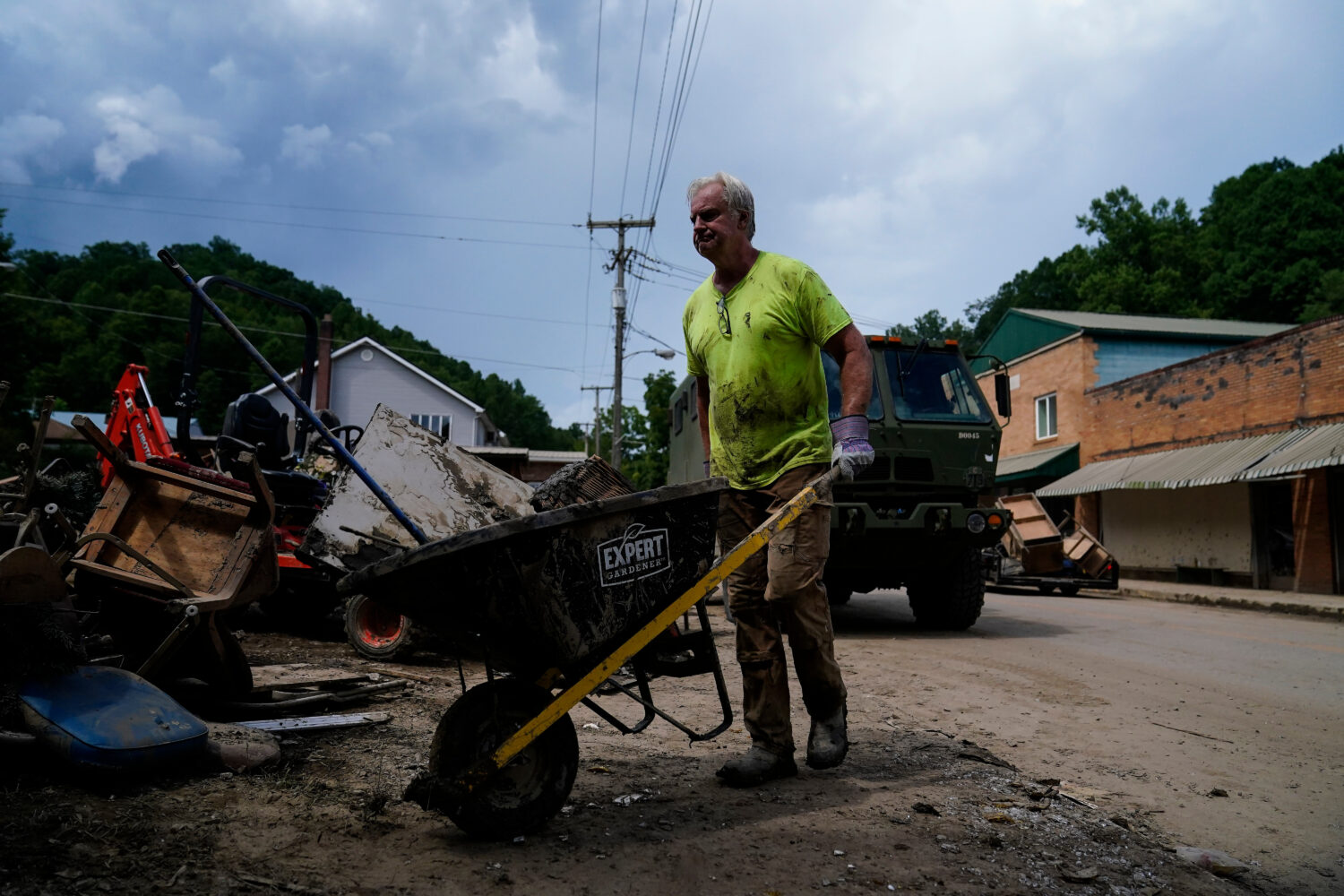 FILE - Jeff Hawkins helps clean his father's antique shop, called Curiosity Shop, Aug. 5, 2022, in ...