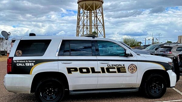 Two men were arrested for allegedly impersonating officers and threatening people in Glendale, authorities said. 