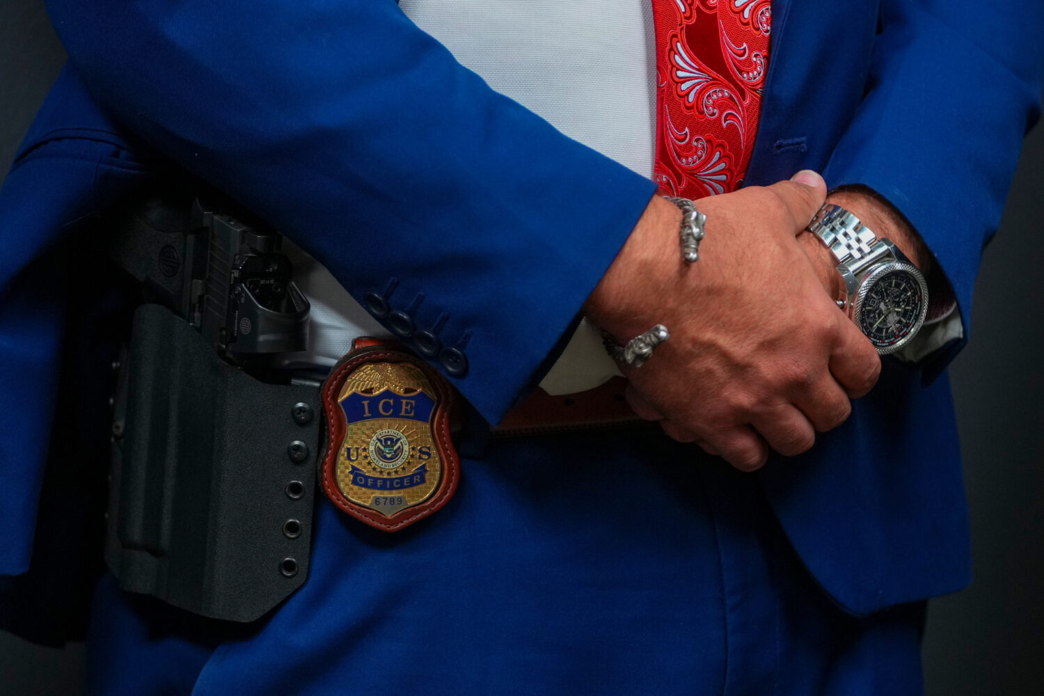 FILE - An Immigration and Customs Enforcement officer's badge is visible during an ICE hiring fair,...