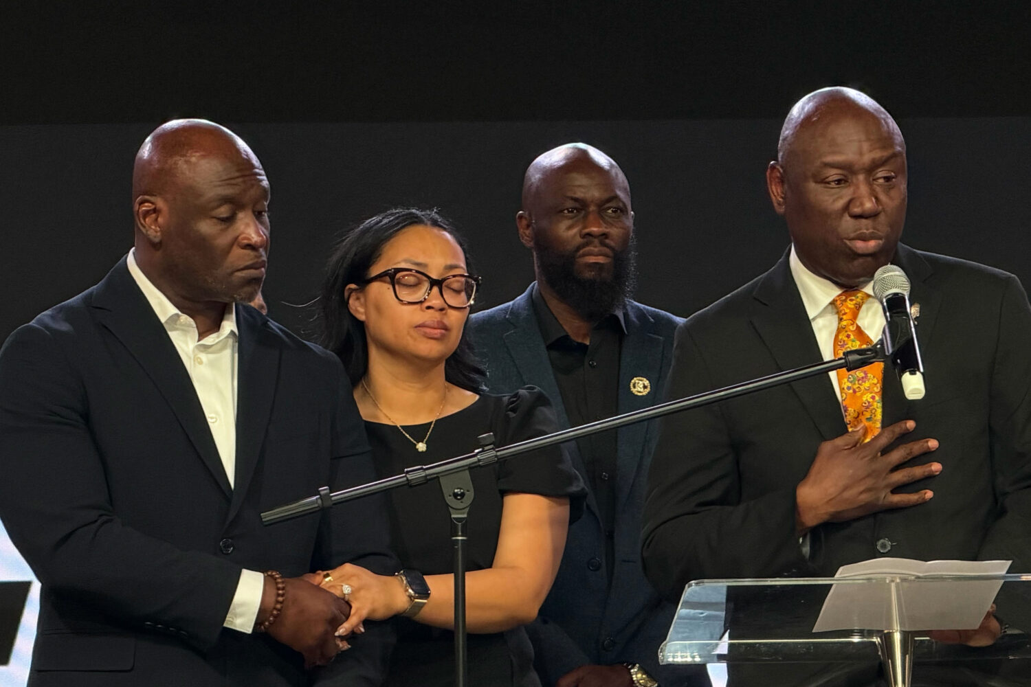 In this photo taken with a smartphone, Ben Crump, right, an attorney for the family of Nolan Wells,...