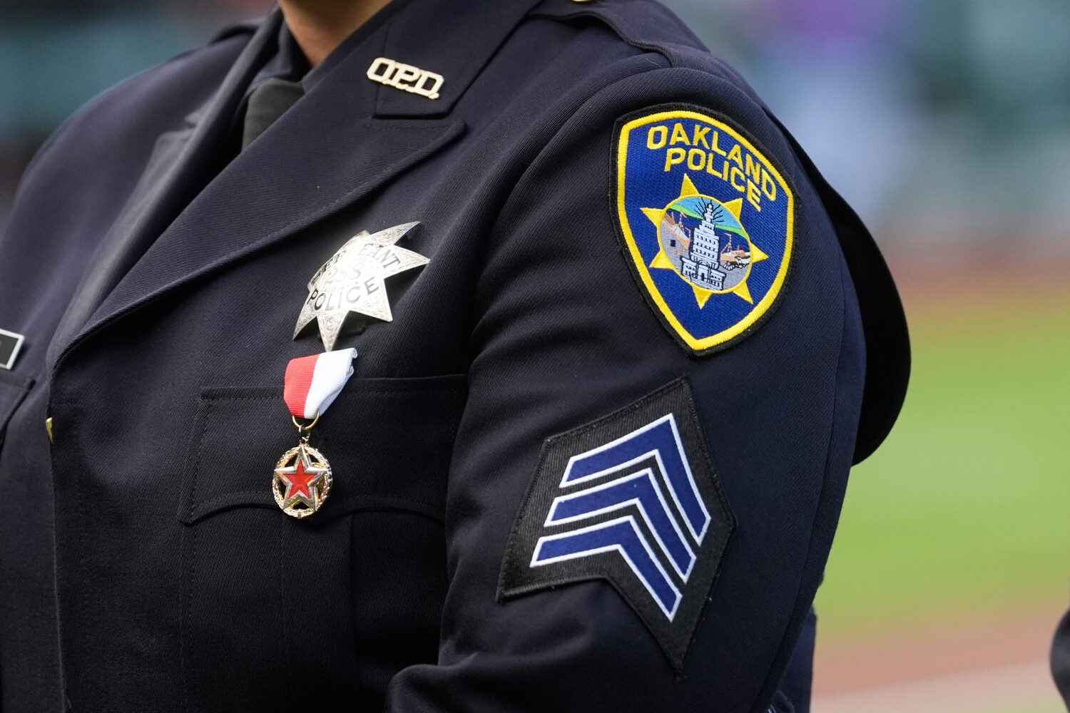 FILE - An Oakland Police Department patch is shown before a baseball game between the San Francisco...