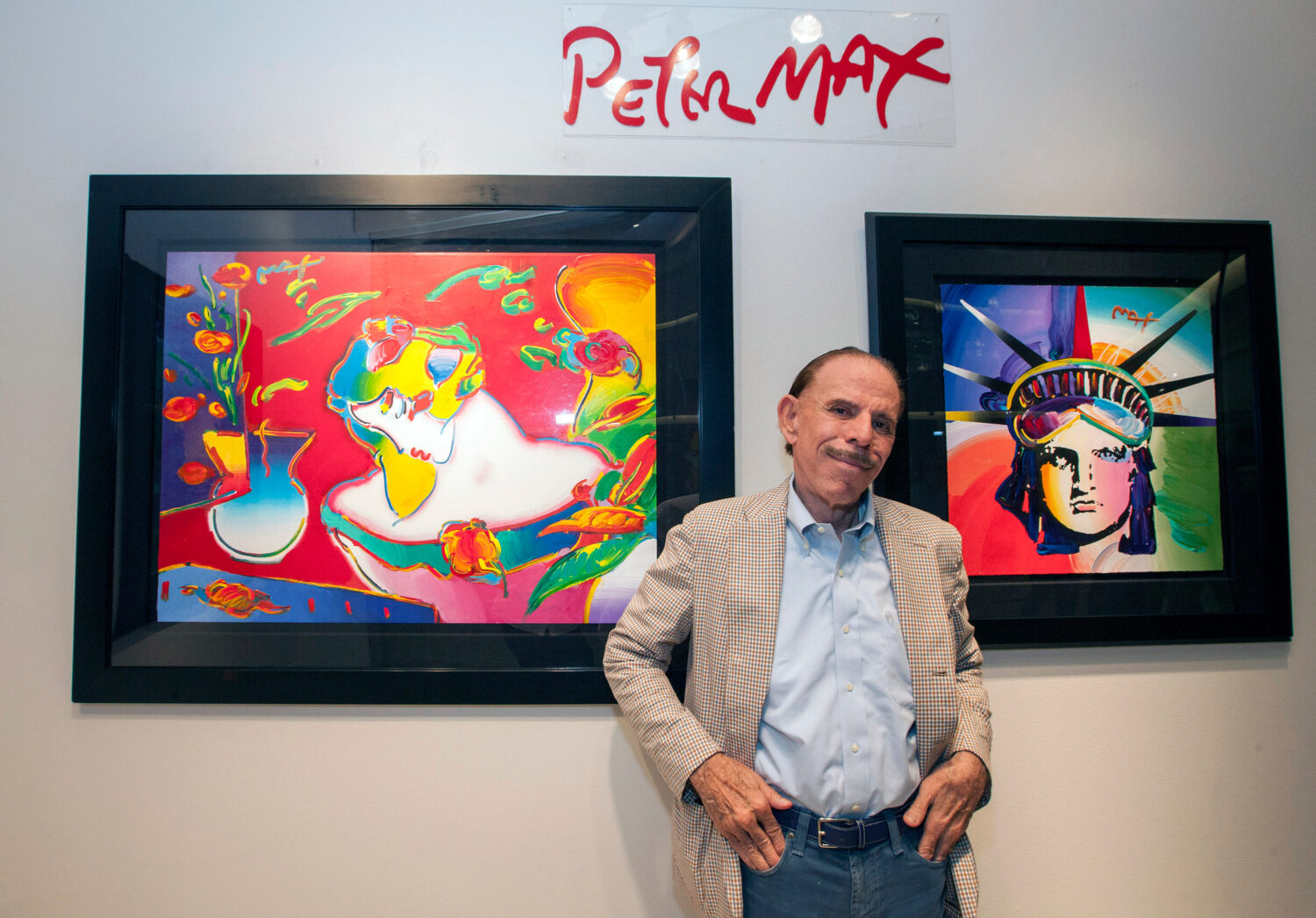 FILE - Artist Peter Max poses for a photo during his retrospective with the Road Show Company exhib...