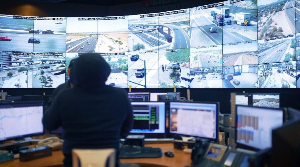 An ADOT operator monitors live freeway camera feeds inside the Traffic Operations Center in Phoenix. (Arizona Department of Transportation)