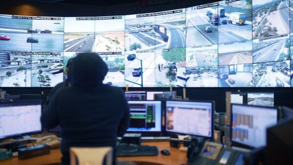 An ADOT operator monitors live freeway camera feeds inside the Traffic Operations Center in Phoenix. (Arizona Department of Transportation)