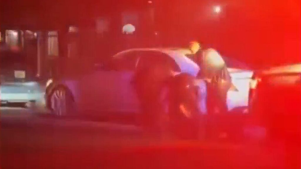 A witness video shows the Aug. 21 traffic stop in which an attorney says Phoenix police pulled De'Yante Smith from his car by his hair. (Screenshot via ABC15)