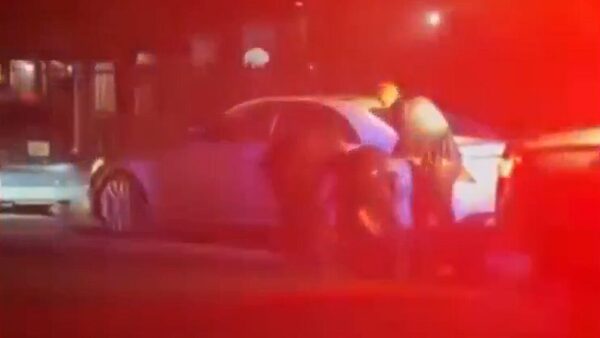 A witness video shows the Aug. 21 traffic stop in which an attorney says Phoenix police pulled De'Yante Smith from his car by his hair. (Screenshot via ABC15)