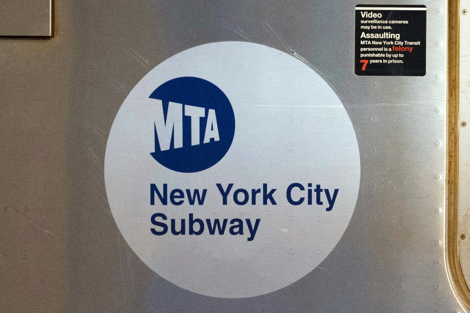 FILE - The MTA logo is seen on the side of a New York City subway car, April 23, 2020, in New York....