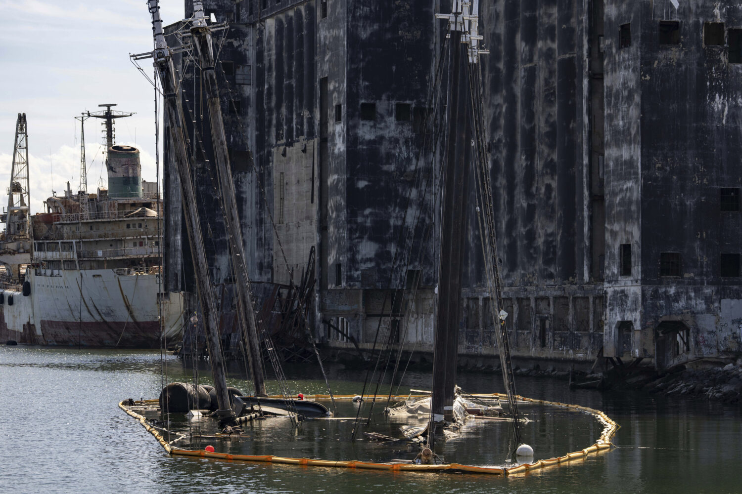 Debris of the Victory Chimes and the Pilot floats in the Henry Street Basin, Wednesday, Aug. 26, 20...