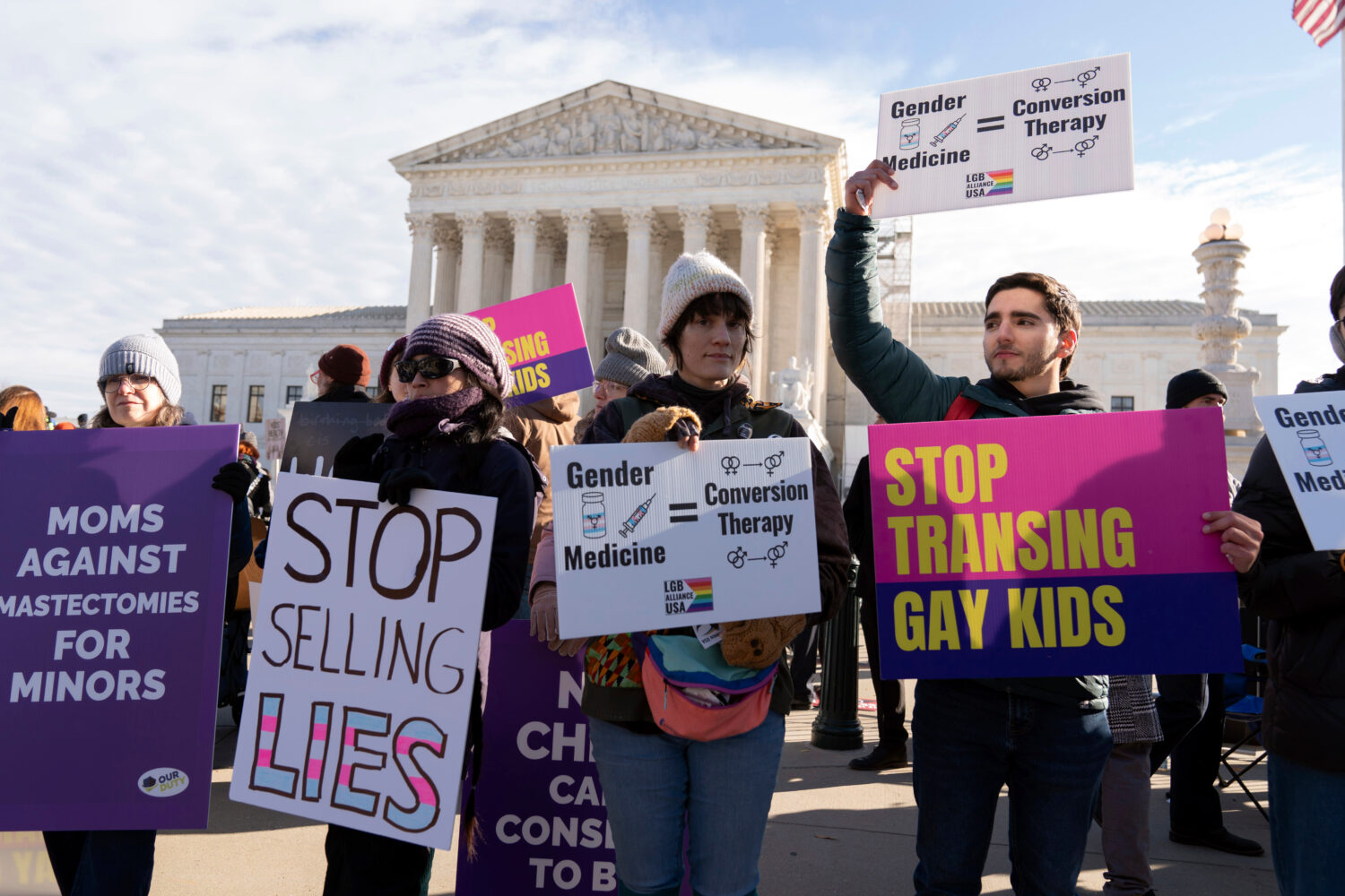 FILE - Demonstrators against transgenders rights protest during a rally outside of the Supreme Cour...