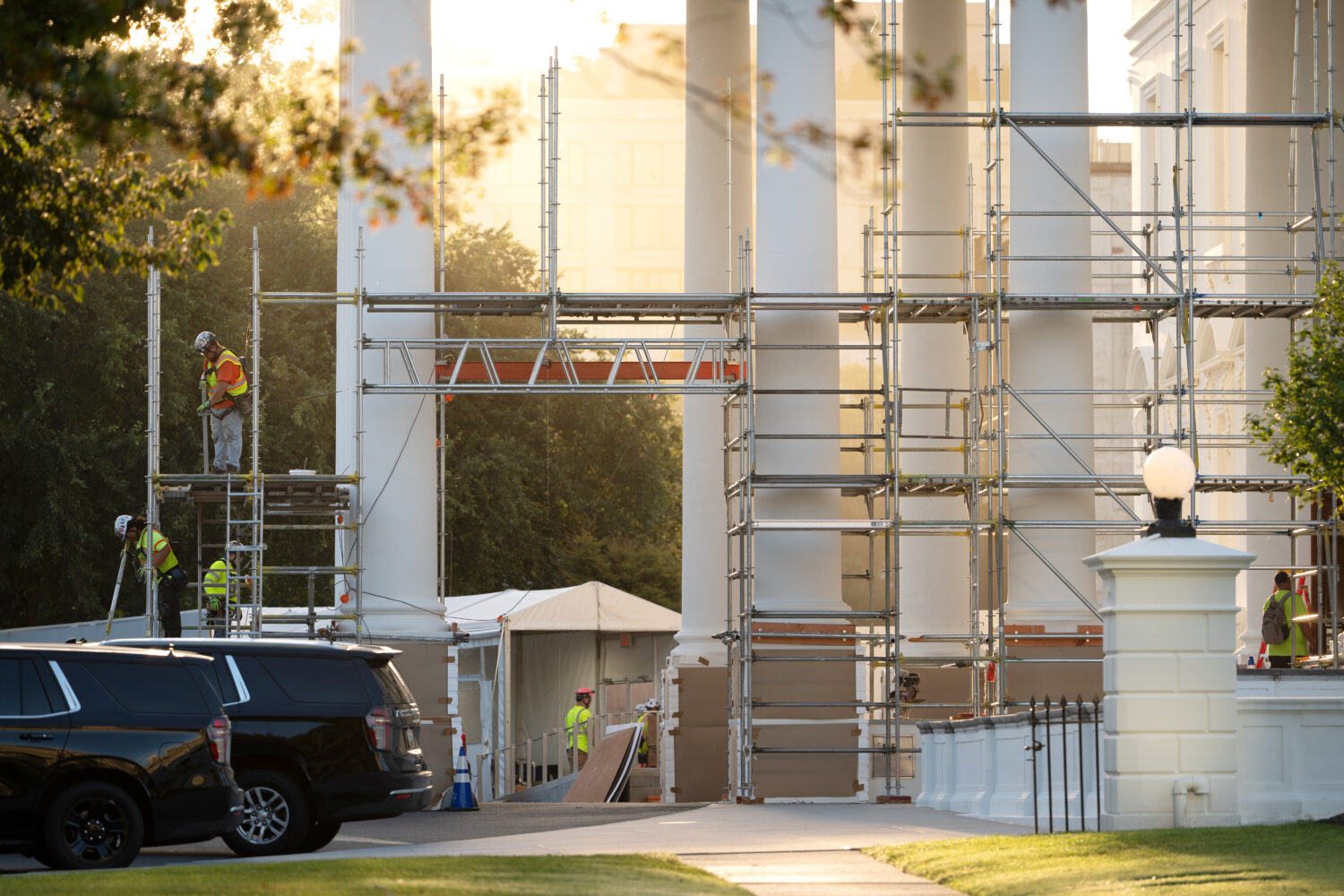 Workers remove scaffolding from columns at the North Portico of the White House, Tuesday, Sept. 8, ...