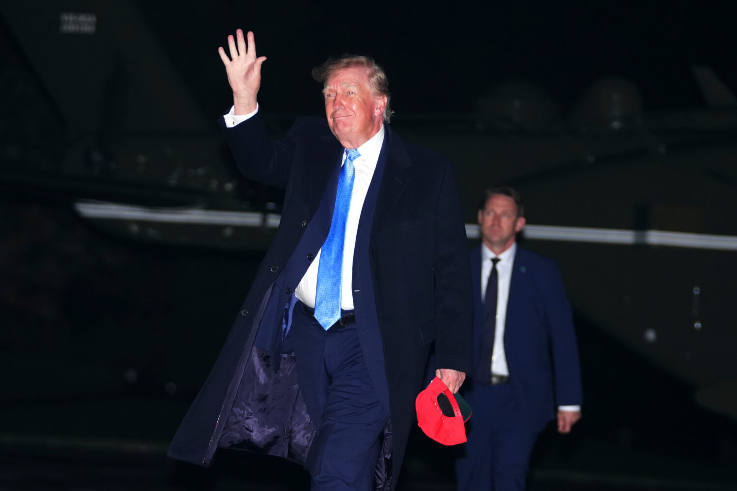 President Donald Trump walks on the South Lawn of the White House after arriving on Marine One, Sun...