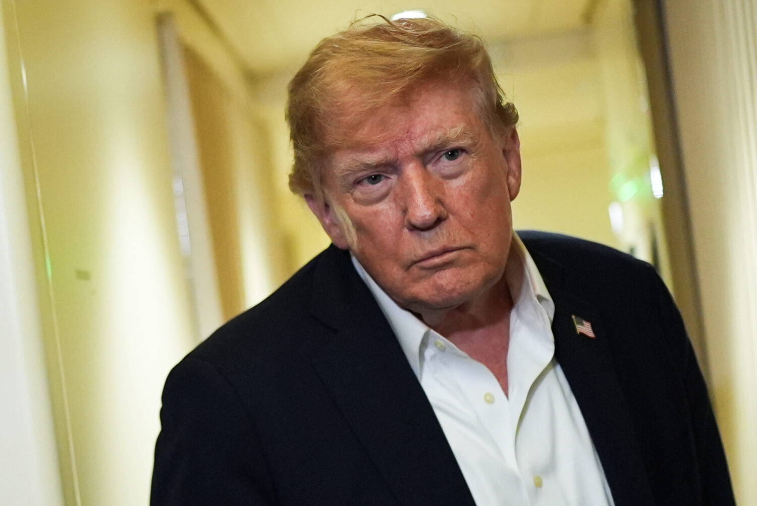 President Donald Trump speaks with reporters while in flight on Air Force One from Shannon, Ireland...