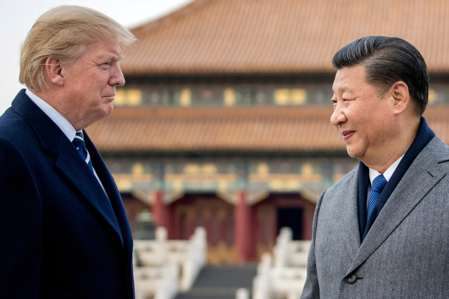 FILE - President Donald Trump, left, and Chinese President Xi Jinping tour the Forbidden City, Nov....