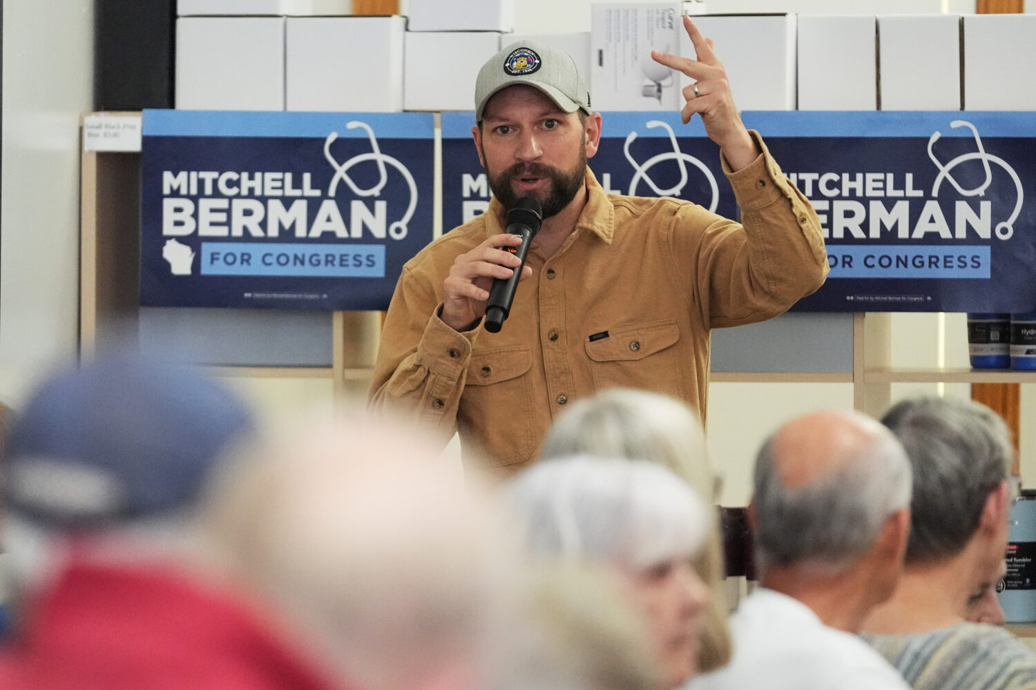 Democratic congressional candidate Mitchell Berman talks to supporters at Wilson's Coffee and Tea i...