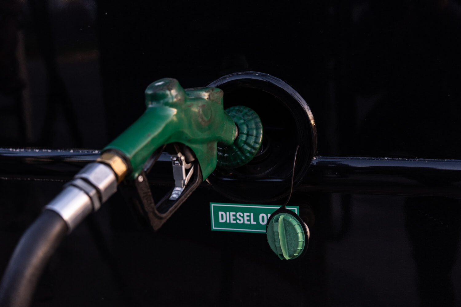 FILE - A nozzle pumps diesel into the fuel tank of bus in Orange, Calif., Tuesday, April 7, 2026. (...