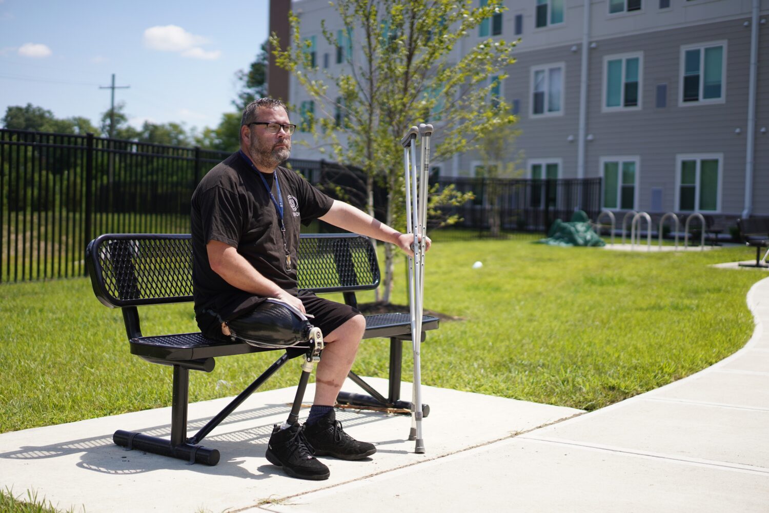 Phillip Sieveking sits outside his permanent supportive apartment in Louisville, Ky., on Thursday, ...