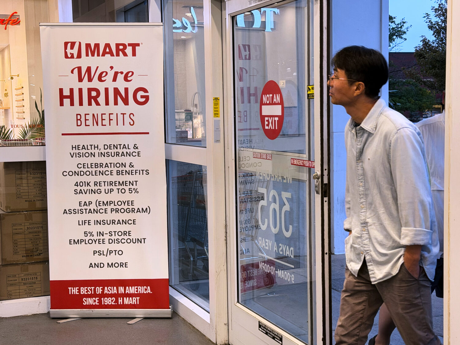 A hiring sign is displayed at a grocery store, in Schaumburg, Ill., Wednesday, Sept. 16, 2026. (AP ...